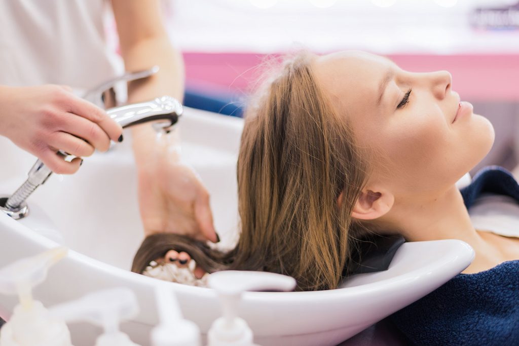 Salon girl combing hair