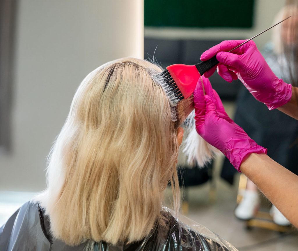 Woman having hair colour